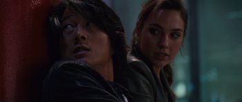 Movie still from “Fast & Furious 6” (2013), directed by Justin Lin – A man and a woman sitting next to each other; Close Up shot, Over the shoulder angle