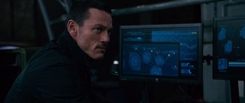 Movie still from “Fast & Furious 6” (2013), directed by Justin Lin – A man sitting in front of a computer monitor; Close Up shot, Over the shoulder angle