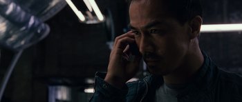 Movie still from “Fast & Furious 6” (2013), directed by Justin Lin – A person talking on a cell phone; Close Up shot, Low angle