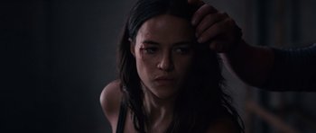 Movie still from “Fast & Furious 6” (2013), directed by Justin Lin – A person with a wound on their face; Close Up shot, High angle