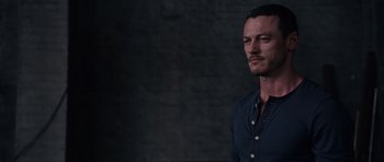 Movie still from “Fast & Furious 6” (2013), directed by Justin Lin – A person wearing a black shirt; Close Up shot, Over the shoulder angle