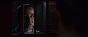 Movie still from “Fast & Furious 6” (2013), directed by Justin Lin – A man looking out of a jail cell through bars; Close Up shot, Over the shoulder angle