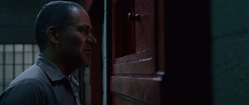 Movie still from “Fast & Furious 6” (2013), directed by Justin Lin – A person leaning against a door; Close Up shot, Over the shoulder angle
