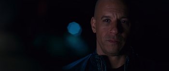 Movie still from “Fast & Furious 6” (2013), directed by Justin Lin – A man with bald head looking at the camera; Close Up shot, Over the shoulder angle