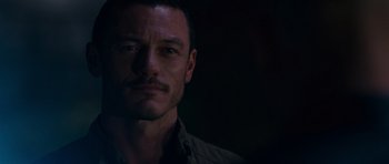 Movie still from “Fast & Furious 6” (2013), directed by Justin Lin – A person wearing a shirt; Close Up shot, Over the shoulder angle