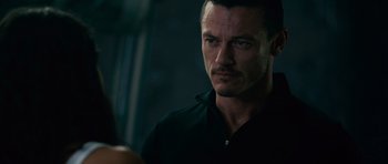 Movie still from “Fast & Furious 6” (2013), directed by Justin Lin – A person wearing a black shirt; Close Up shot, Over the shoulder angle