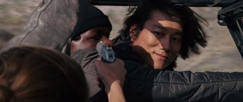 Movie still from “Fast & Furious 6” (2013), directed by Justin Lin – A man holding a gun up to a woman's face; Close Up shot, Over the shoulder angle