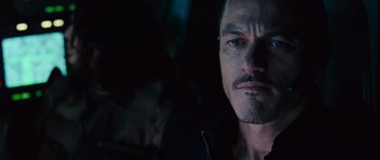 Movie still from “Fast & Furious 6” (2013), directed by Justin Lin – A person with a beard; Close Up shot, Over the shoulder angle