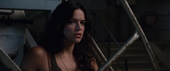 Movie still from “Fast & Furious 6” (2013), directed by Justin Lin – A beautiful young woman with long black hair; Close Up shot, Low angle