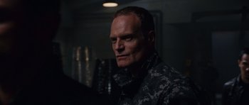 Movie still from “Fast & Furious 6” (2013), directed by Justin Lin – A person wearing a military uniform; Close Up shot, Low angle