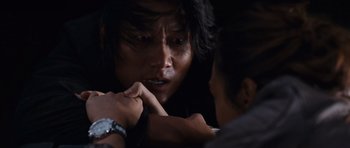Movie still from “Fast & Furious 6” (2013), directed by Justin Lin – A man holding a woman's hand while she looks at him; Close Up shot, Over the shoulder angle
