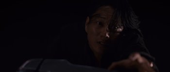 Movie still from “Fast & Furious 6” (2013), directed by Justin Lin – A man is looking out of a car window at night; Close Up shot, Overhead angle