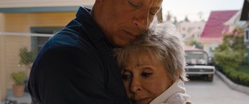 Movie still from “Fast X” (2023), directed by Justin Lin – An older man and a younger woman hugging; Close Up shot, Low angle