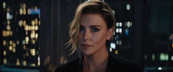 Movie still from “Fast X” (2023), directed by Justin Lin – A person with short hair; Close Up shot, Over the shoulder angle