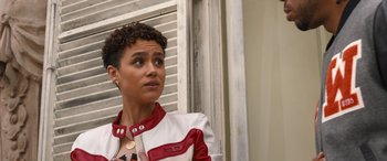 Movie still from “Fast X” (2023), directed by Justin Lin – A woman that is wearing a jacket; Close Up shot, Over the shoulder angle