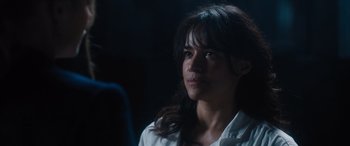 Movie still from “Fast X” (2023), directed by Justin Lin – A person wearing a white shirt; Close Up shot, Over the shoulder angle