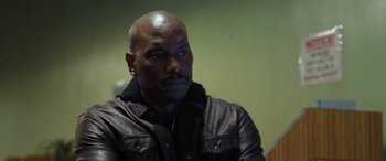 Movie still from “Fast X” (2023), directed by Justin Lin – A man in a leather jacket looking into the distance; Close Up shot, Over the shoulder angle