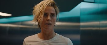 Movie still from “Fast X” (2023), directed by Justin Lin – A person wearing a white t - shirt; Close Up shot, Over the shoulder angle