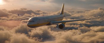 Movie still from “Fast X” (2023), directed by Justin Lin – An airplane is flying through the clouds in the sky; Extreme Wide shot, Overhead angle