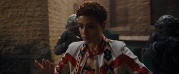 Movie still from “Fast X” (2023), directed by Justin Lin – A woman in a leather jacket looking at the camera; Close Up shot, Over the shoulder angle