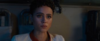 Movie still from “Fast X” (2023), directed by Justin Lin – A person wearing a white and red shirt; Close Up shot, Over the shoulder angle