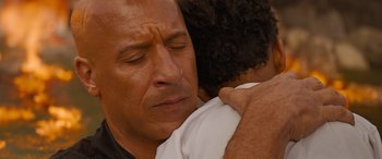 Movie still from “Fast X” (2023), directed by Justin Lin – A man and a woman are hugging each other; Close Up shot, Over the shoulder angle