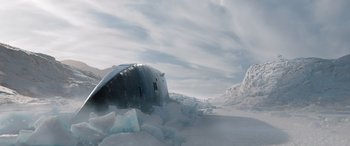 Movie still from “Fast X” (2023), directed by Justin Lin – An old boat is sitting in the middle of the ice; Extreme Wide shot, Low angle