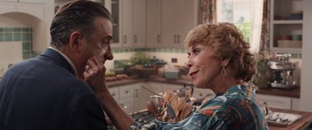 Movie still from “Father of the Bride” (2022), directed by Gary Alazraki – A man and a woman sitting at a kitchen counter; Close Up shot, Over the shoulder angle