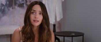 Movie still from “Father of the Bride” (2022), directed by Gary Alazraki – A beautiful young lady with long brown hair and brown eyes; Close Up shot, Over the shoulder angle