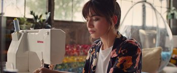 Movie still from “Father of the Bride” (2022), directed by Gary Alazraki – A woman looking at her reflection in a mirror; Medium shot, High angle