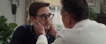 Movie still from “Father of the Bride” (2022), directed by Gary Alazraki – A man with glasses is looking at another man's face; Close Up shot, Over the shoulder angle