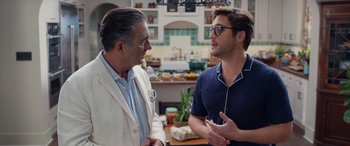 Movie still from “Father of the Bride” (2022), directed by Gary Alazraki – Two men are talking in a kitchen; Medium shot, Over the shoulder angle