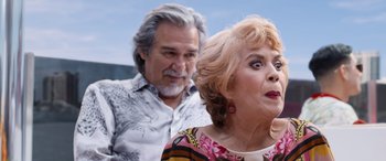 Movie still from “Father of the Bride” (2022), directed by Gary Alazraki – An older man and a younger woman standing next to each other; Close Up shot, Over the shoulder angle