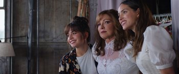 Movie still from “Father of the Bride” (2022), directed by Gary Alazraki – A group of women standing next to each other; Medium shot, Over the shoulder angle