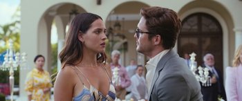 Movie still from “Father of the Bride” (2022), directed by Gary Alazraki – A man and a woman standing next to each other in front of a crowd; Close Up shot, Over the shoulder angle