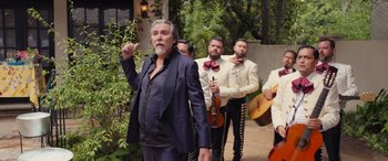 Movie still from “Father of the Bride” (2022), directed by Gary Alazraki – A group of men standing next to each other; Wide shot, Over the shoulder angle