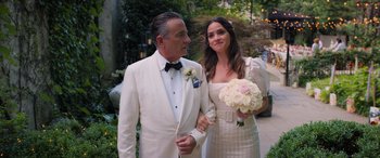 Movie still from “Father of the Bride” (2022), directed by Gary Alazraki – A man and a woman dressed in formal attire; Medium shot, High angle