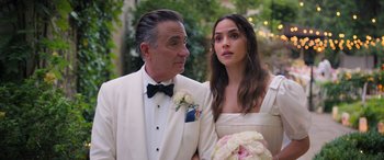 Movie still from “Father of the Bride” (2022), directed by Gary Alazraki – An older man in a tuxedo and a young woman in a white dress; Close Up shot, Over the shoulder angle