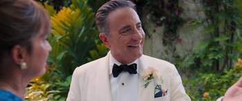Movie still from “Father of the Bride” (2022), directed by Gary Alazraki – A person wearing a suit and a bow tie; Close Up shot, Over the shoulder angle