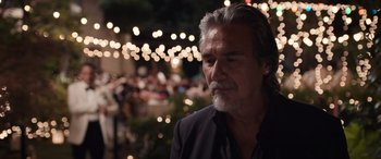 Movie still from “Father of the Bride” (2022), directed by Gary Alazraki – An older man with gray hair and a gray beard; Close Up shot, Over the shoulder angle