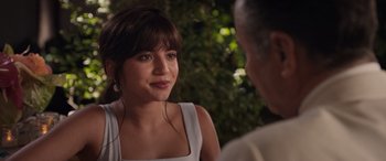 Movie still from “Father of the Bride” (2022), directed by Gary Alazraki – A woman in a white dress talking to a man; Close Up shot, Over the shoulder angle