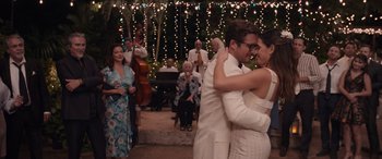 Movie still from “Father of the Bride” (2022), directed by Gary Alazraki – A man and a woman dancing in front of a crowd; Medium shot, Over the shoulder angle