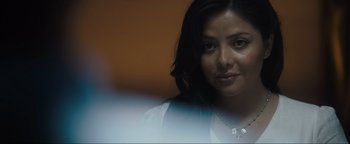 Movie still from “Father Stu” (2022), directed by Rosalind Ross – A person wearing a white shirt; Close Up shot, Over the shoulder angle