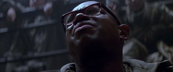 Movie still from “Alien³” (1992), directed by David Fincher – A person wearing glasses looking up; Close Up shot, Low angle