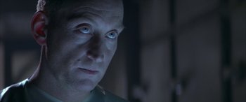 Movie still from “Alien³” (1992), directed by David Fincher – A person with blue eyes; Close Up shot, Over the shoulder angle