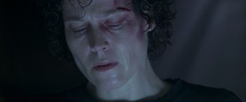 Movie still from “Alien³” (1992), directed by David Fincher – A person with a bruised eye; Close Up shot, Low angle