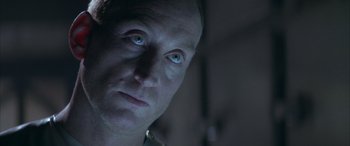 Movie still from “Alien³” (1992), directed by David Fincher – A person with blue eyes; Close Up shot, Low angle