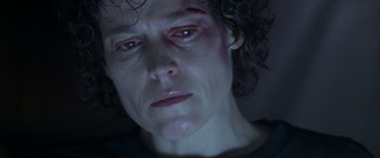 Movie still from “Alien³” (1992), directed by David Fincher – A person with a scar on their face; Close Up shot, Low angle