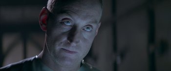 Movie still from “Alien³” (1992), directed by David Fincher – A person with blue eyes; Close Up shot, Overhead angle