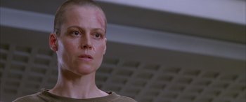 Movie still from “Alien³” (1992), directed by David Fincher – A person with a shaved head; Close Up shot, Low angle